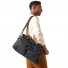 Filson 48-Hour Tin Cloth Duffle Bag wearing on shoulder