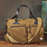 Filson 48-Hour Tin Cloth Duffle Bag Dark Tan on a table