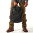 Filson Dryden Backpack Dark Navy wearing in hand
