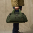 Filson Dryden Duffle Pack Otter Green Wearing in hand