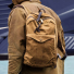 Filson Journeyman Backpack 20231638 Tan carrying on the shoulder