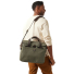 Filson Rugged Twill Original Briefcase Otter Green wearing on shoulder