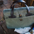 Filson Rugged Twill Original Briefcase Otter Green with newspaper