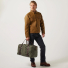 Filson Rugged Twill Duffle Bag Medium Otter Green carrying in hand