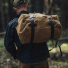 Filson Rugged Twill Duffle Bag Medium Tan wearing over shoulder
