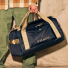 Filson Scout 50L Duffle Black/Covert back carrying in hand