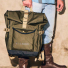 Filson Scout Backpack Olive/Black/Covert carrying in hand