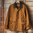 Filson Tin Cloth Field Jacket Dark Tan on a hanger