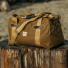 Filson Tin Cloth Medium Duffle Bag Dark Tan on wood