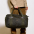 Filson Tin Cloth Medium Duffle Bag Otter Green carrying-in-hand