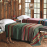 Pendleton Yakima Camp Blanket Throw Green Heather on bed