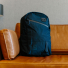 Topo Designs Daypack Tech Navy on the couch