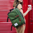 Topo Designs Global Briefcase Olive wearing on shoulder