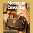 Topo Designs Mountain Cross Bag Black/Neutral wearing on shoulder