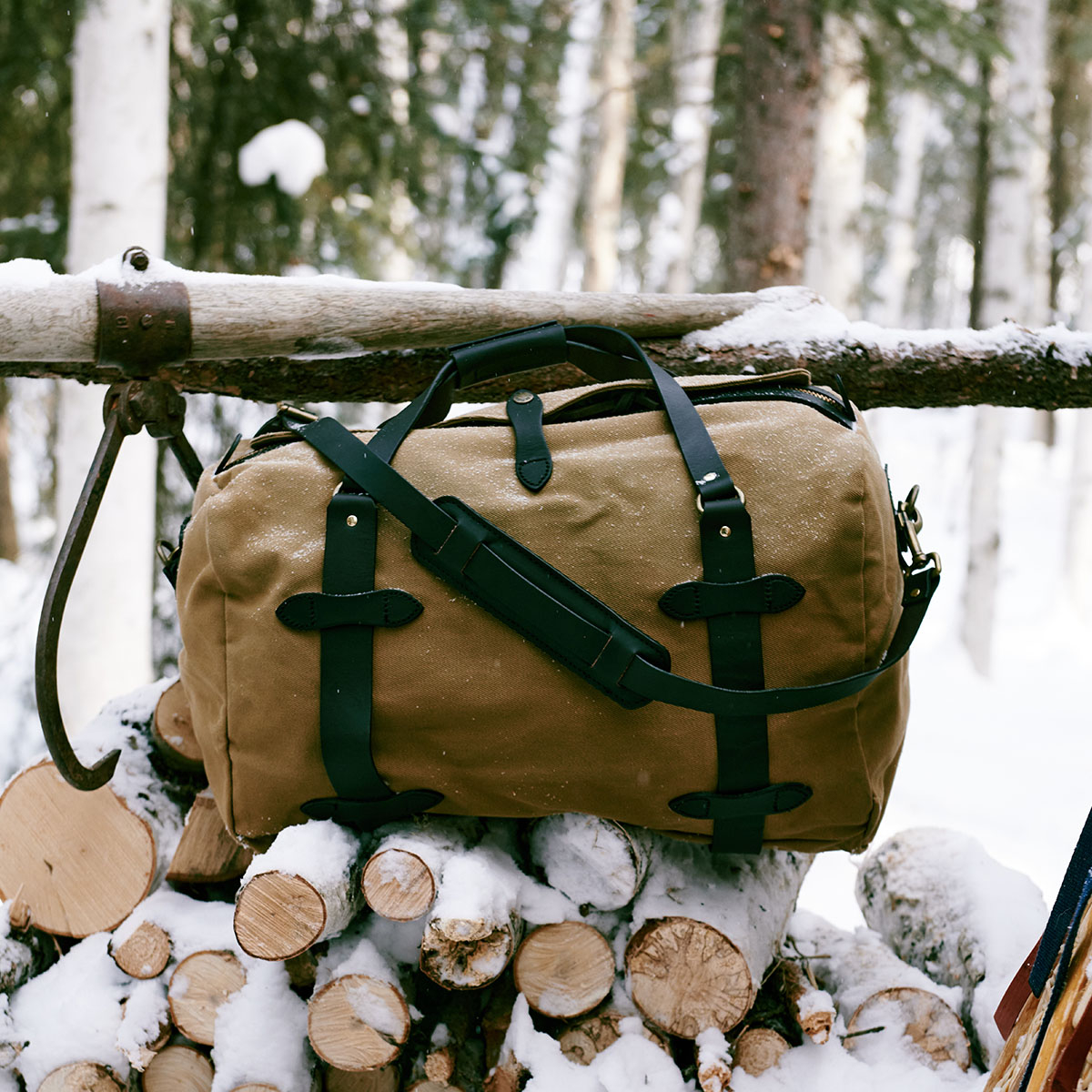 Filson Rugged Twill Duffle Bag Medium Tan, in the snow